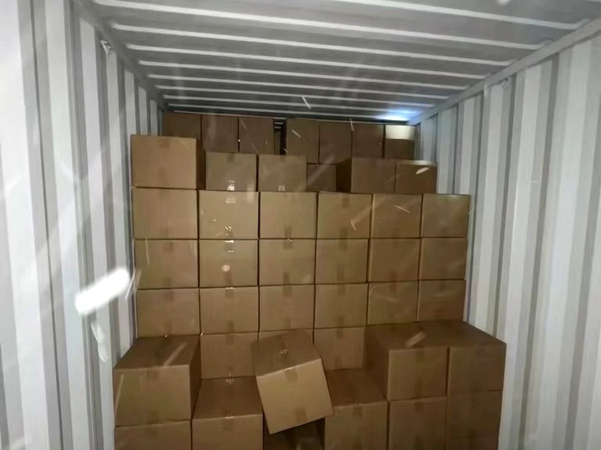 Carton boxes loaded deep inside a container for overseas shipment.